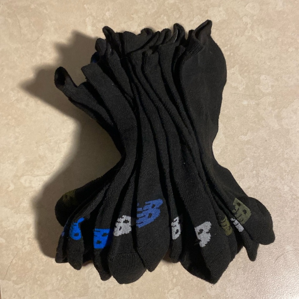 New balance socks brand new. Never worn. 8 pairs 16 socks total) size 9-12